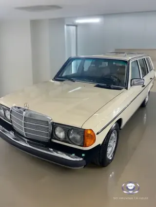Cream Mercedes W123 Wagon in shop