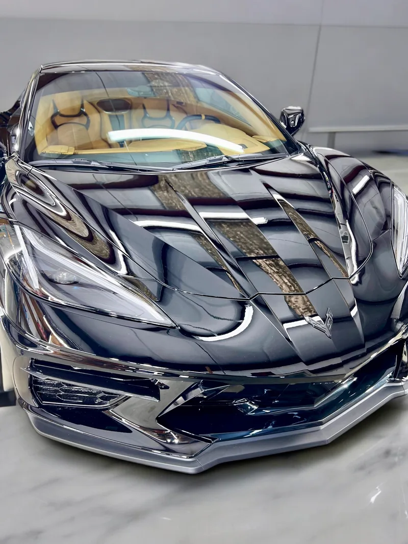 Black Corvette C8 in shop